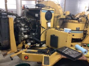 wood chipper getting its diesel engine repaired